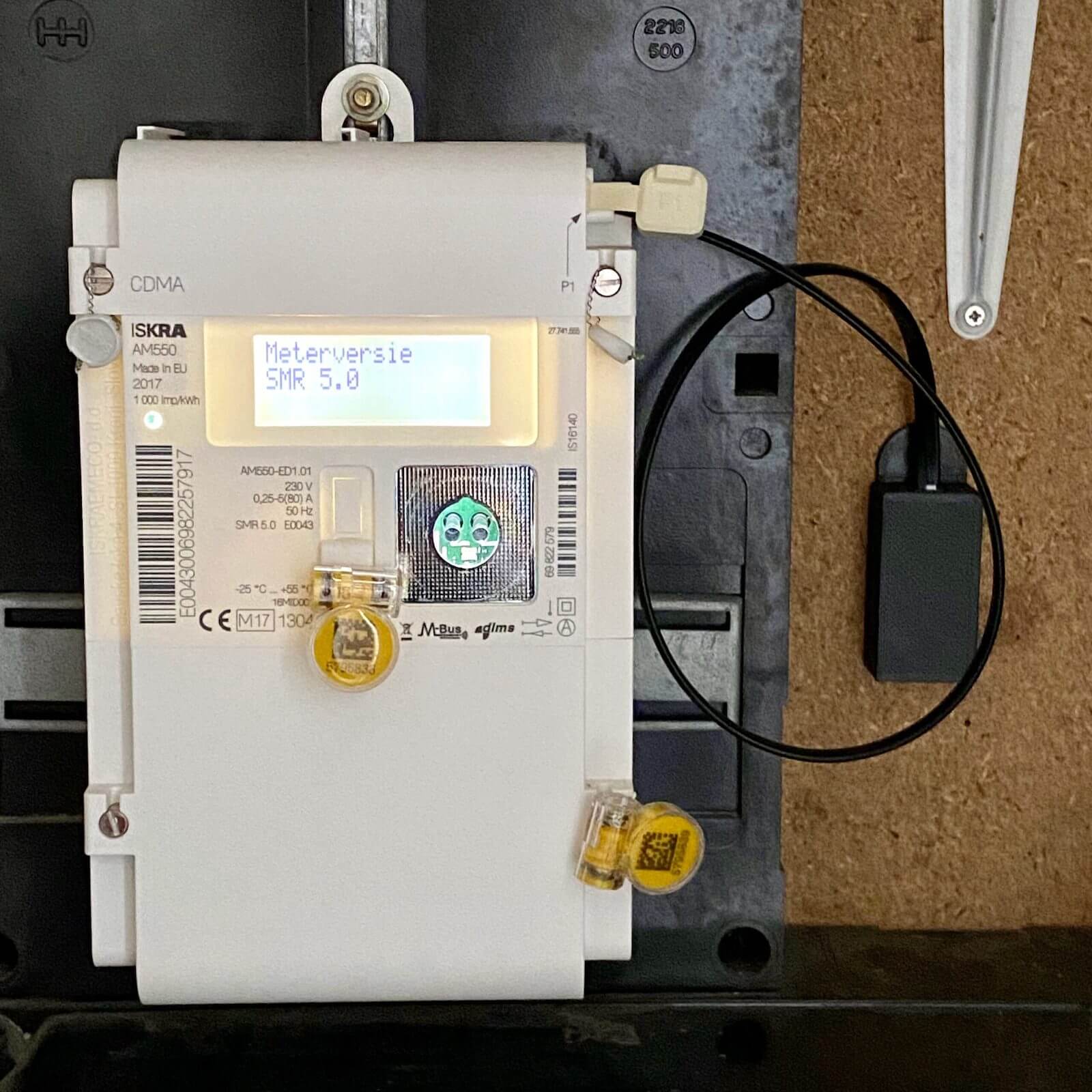 Photo of SlimmeLezer attached to a smart electricity meter